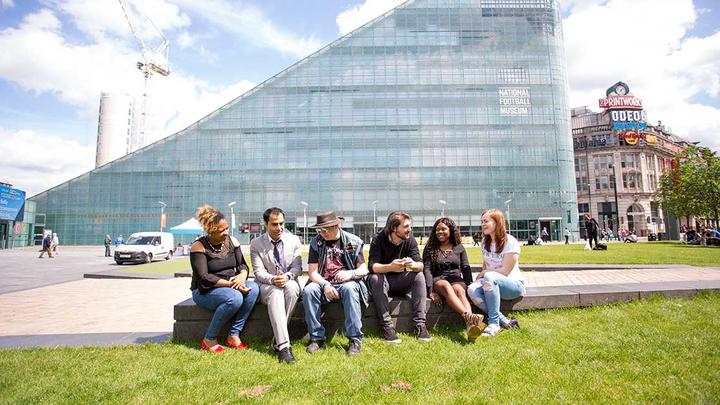 A group of people sat outside talking