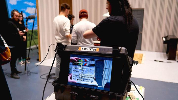 Close up of a video camera screen filming on set