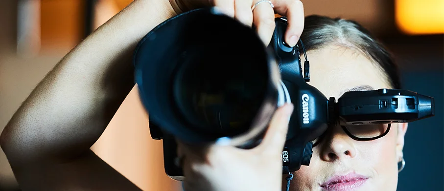 Looking down the lens of a camera